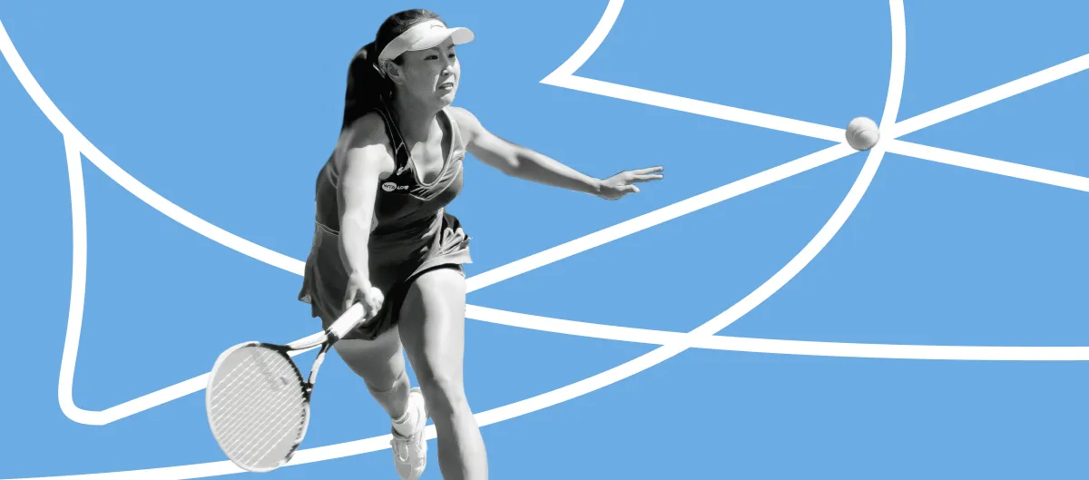 A tennis player reaching for a ball in front of an abstract blue background with white lines