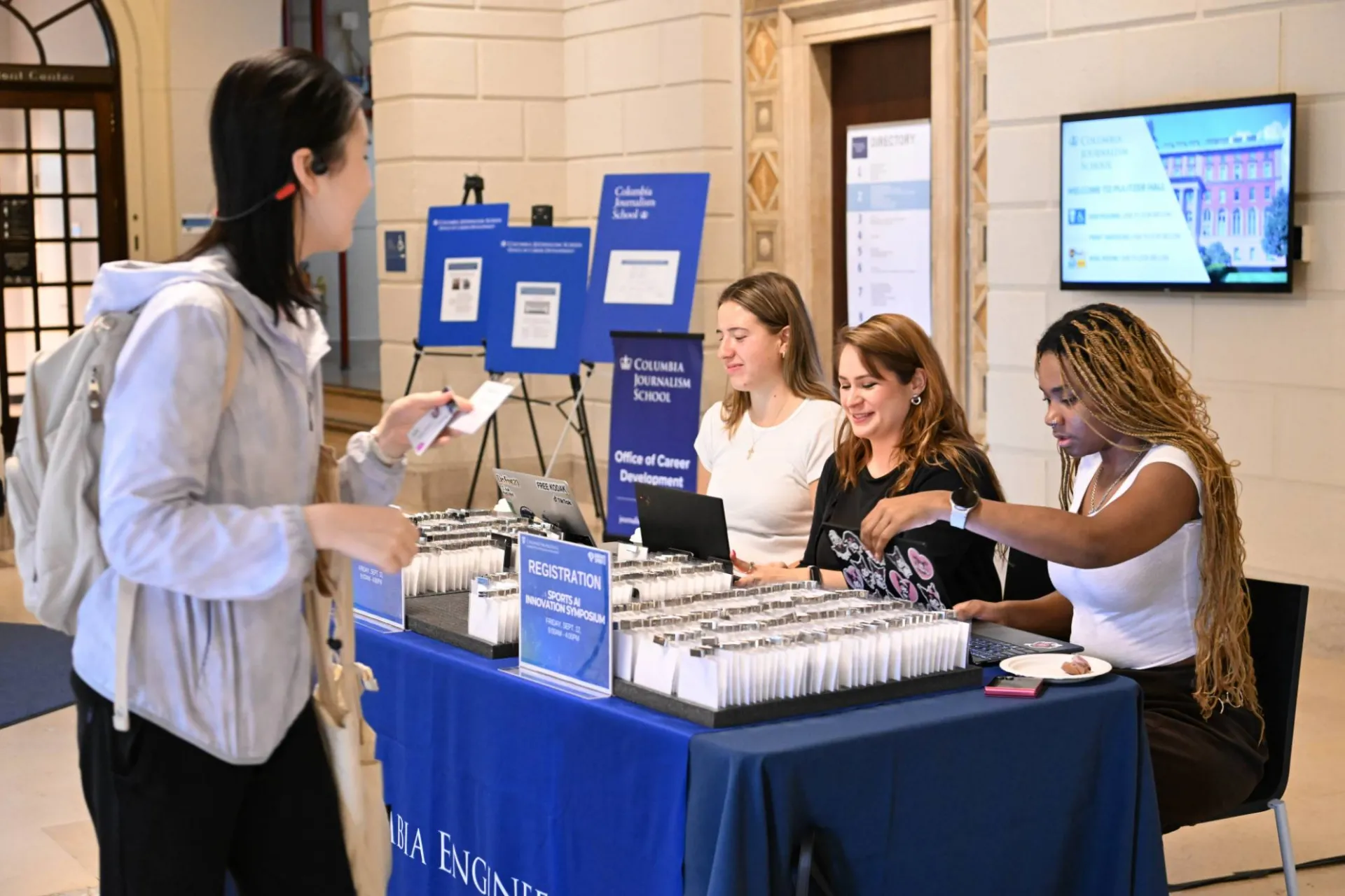 participant checking in at a columbia engineering event booth