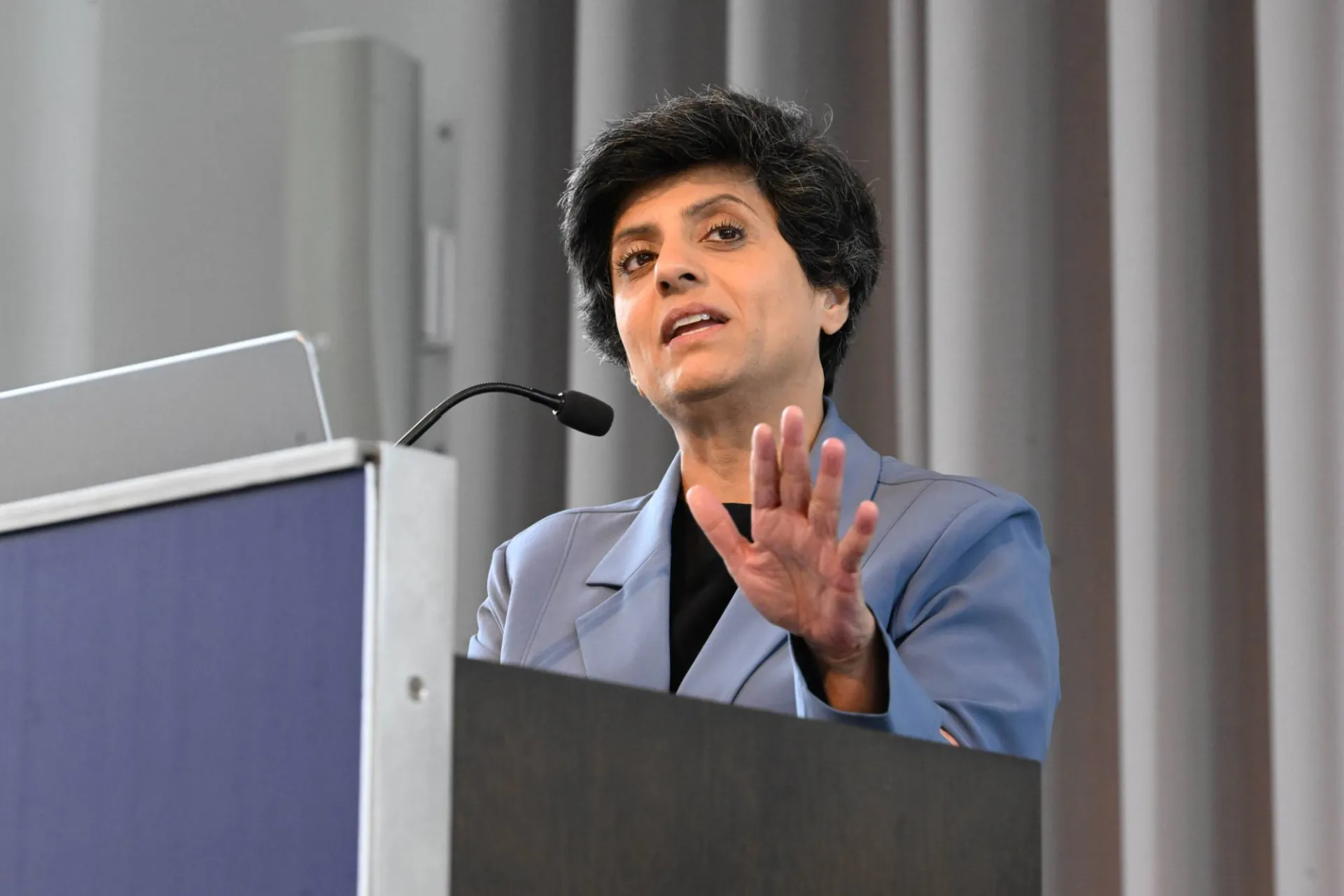 close up photo of opening keynote speaker Priya Narasimhan speaking at the podium