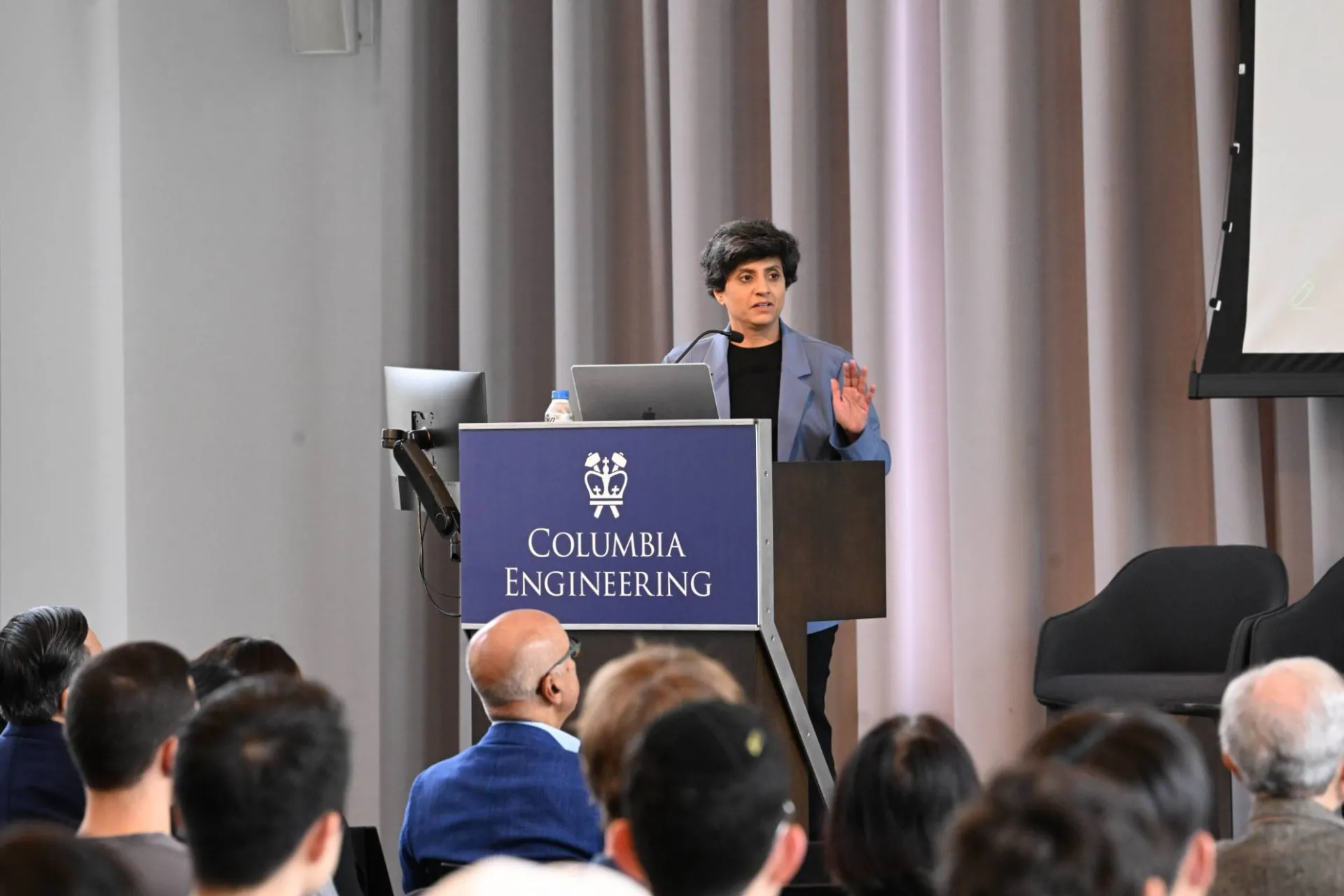 close up photo of opening keynote speaker Priya Narasimhan speaking at the podium